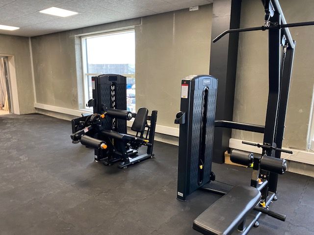 Funktionelt træningsområde i Sportsgroup Danmark med vægte og styrkeudstyr